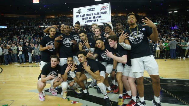 Providence celebrates winning the Big East regular season championship after defeating Creighton in an NCAA college basketball game Saturday, Feb. 26, 2022, in Providence, R.I.